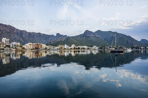 Village by the sea and mountains at sunrise, Port de Pollenca, Serra de Tramuntana, Majorca, Balearic Islands, Spain, Europe