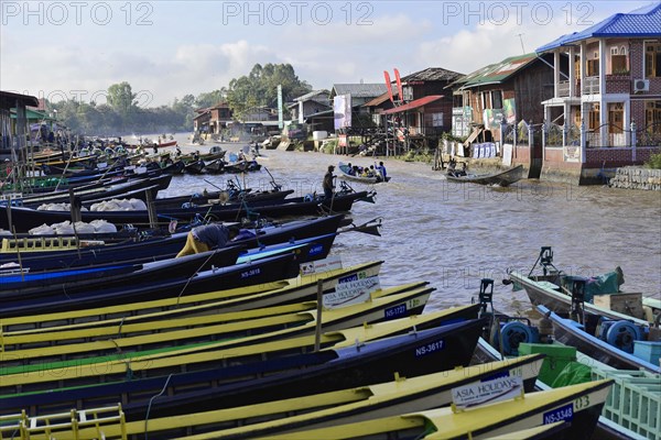 View of docked boats on a cloudy day with an overcast sky, Pindaya, Inle Lake, Myanmar, Asia