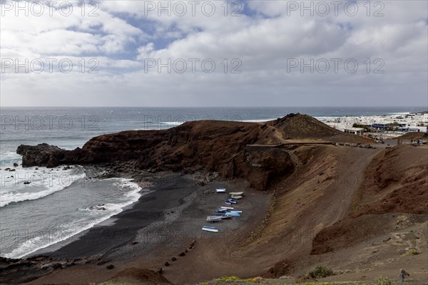Fishing boats on the black beach of El Golfo, volcanic crater, Lanzarote, Canary Islands, Spain, Europe
