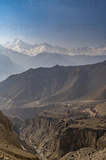 Desert mountain scenery with the Annapurna mountain range in the background, Kingdom of Mustang, Nepal, Asia