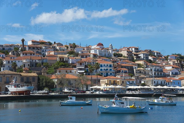 A picturesque coastal town on a sunny day with boats in the water, Koroni, Pylos-Nestor, Messinia, Peloponnese, Greece, Europe
