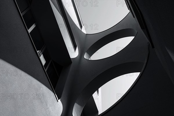 Modern architectural detail with curved shapes and shadow play, AI generated