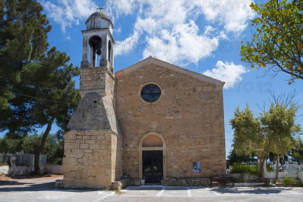 Ancient stone church with a free-standing bell tower under a bright blue sky, Holy Church of Agios Charalambos, Byzantine fortress, Koroni, Pylos-Nestor, Messinia, Peloponnese, Greece, Europe