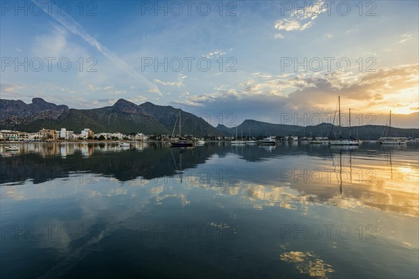 Village by the sea and mountains at sunrise, Port de Pollenca, Serra de Tramuntana, Majorca, Balearic Islands, Spain, Europe