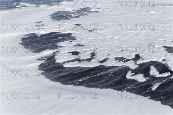 Winter, snow drifts on frozen riverscape, Saint Lawrence River, Province of Quebec, Canada, North America