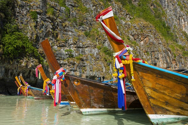 Longtail boat at Maya Bay, boat, wooden boat, ferry boat, ferry, passenger ferry, decorated, faith, tradition, Thai, Asian, traditional, sea, ocean, Andaman Sea, tropics, tropical, island, rock, rock, water, fisherman, fishing boat, travel, tourism, beach holiday, beach holiday, holiday, dream trip, holiday paradise, flora, paradise, coastal landscape, nature, idyllic, boat, turquoise, Siam, exotic, Ko Phi Phi Don, Thailand, Asia