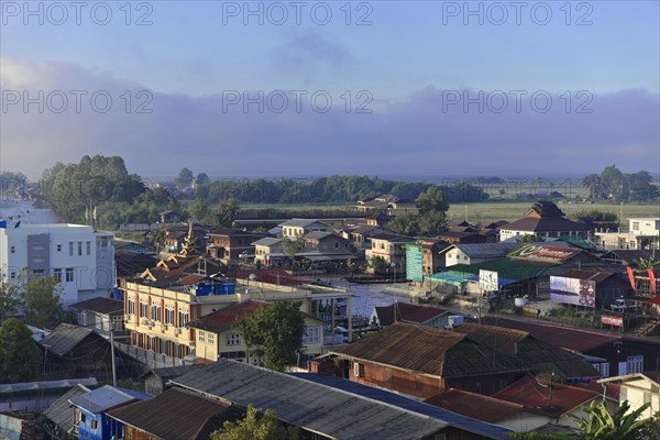 View of a town with traditional buildings at dawn, Pindaya, Inle Lake, Myanmar, Asia