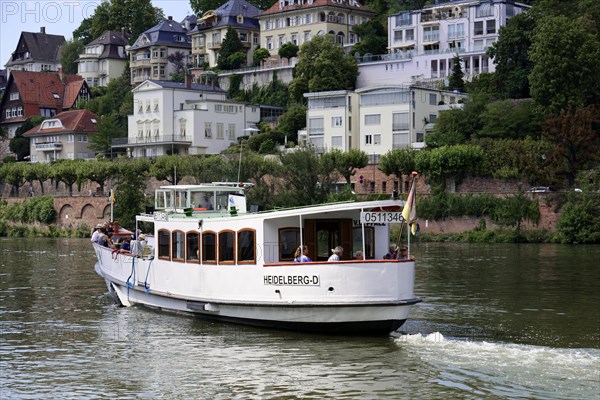 Close-up view of a boat on the water (Neckar), with passengers and a name plate, Heidelberg, Baden-Wuerttemberg, Germany, Europe