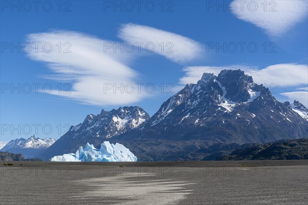 Iceberg and cloud formation, Lago Grey, Torres del Paine National Park, Parque Nacional Torres del Paine, Cordillera del Paine, Towers of the Blue Sky, Region de Magallanes y de la Antartica Chilena, Ultima Esperanza Province, UNESCO Biosphere Reserve, Patagonia, End of the World, Chile, South America