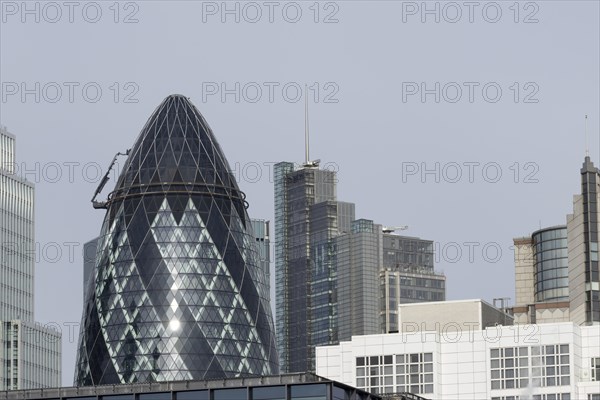 The Gherkin skyscraper building and nearby high rise office buildings, City of London, England, United Kingdom, Europe