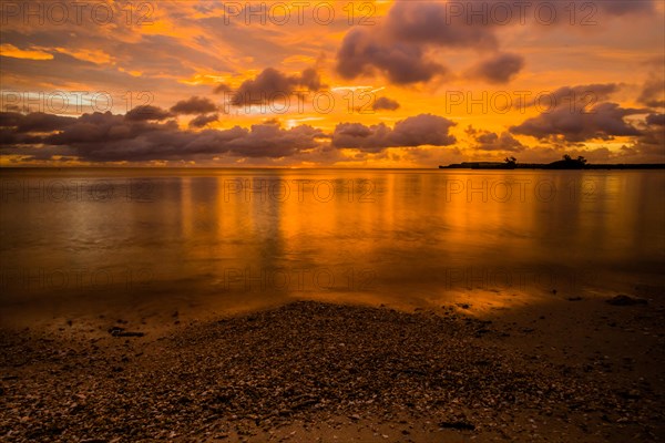 Beautiful sunset over ocean water taken from a beach in Guam