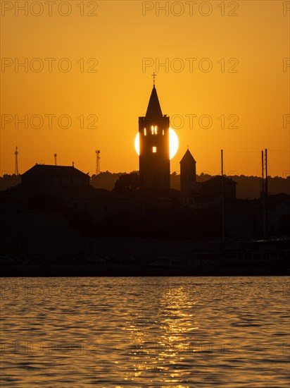 Golden evening light at sunset, silhouette of the church towers of Rab, town of Rab, island of Rab, Kvarner Gulf Bay, Croatia, Europe