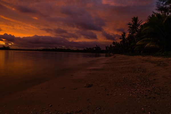 Beautiful sunset over ocean water taken from a beach in Guam