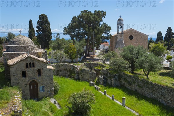 Old church surrounded by ruins in a rural area with tall cypress trees, Temple of Apollo of ancient Assinai, Byzantine fortress, nunnery, monastery, Koroni, Pylos-Nestor, Messinia, Peloponnese, Greece, Europe