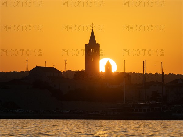 Sunset, silhouette of the church towers of Rab, town of Rab, island of Rab, Kvarner Gulf Bay, Croatia, Europe