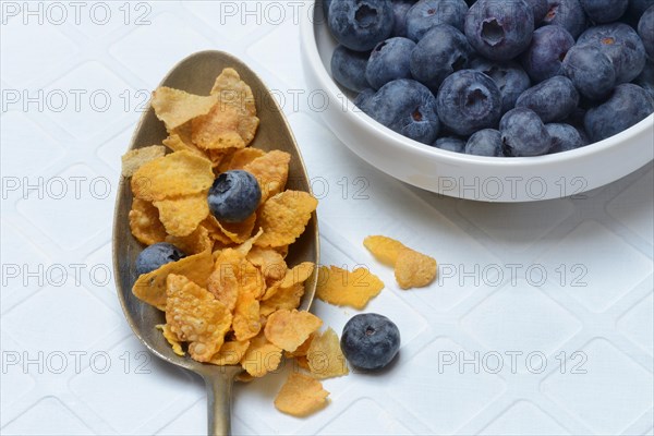 Cornflakes and blueberries in spoon, Breakfast