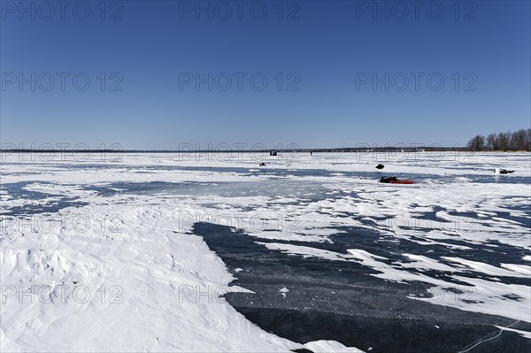 Winter, snow drifts on frozen riverscape, Saint Lawrence River, Province of Quebec, Canada, North America