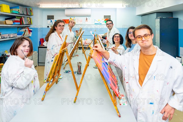 Portrait of a painting class in a center for disabled people