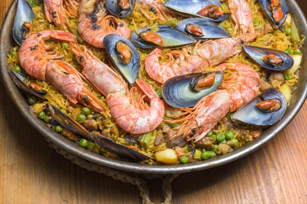 Brightly colored seafood paella presented in a traditional pan, typical Spanish cuisine, Majorca, Balearic Islands, Spain, Europe