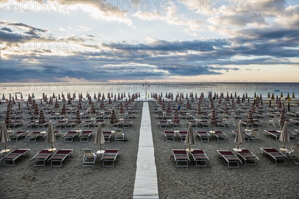 Empty beach and beach loungers, sunrise, Spotorno, Riviera di Ponente, Liguria, Italy, Europe