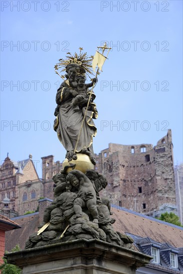 Sculpture on a golden pedestal, Marienbrunnen, in front of the ruins of a castle, Heidelberg, Baden-Wuerttemberg, Germany, Europe