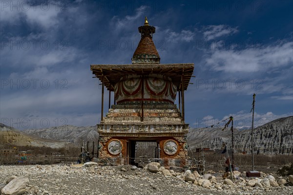 Colourfully painted Buddhist stupa, Tsarang, Kingdom of Mustang, Nepal, Asia