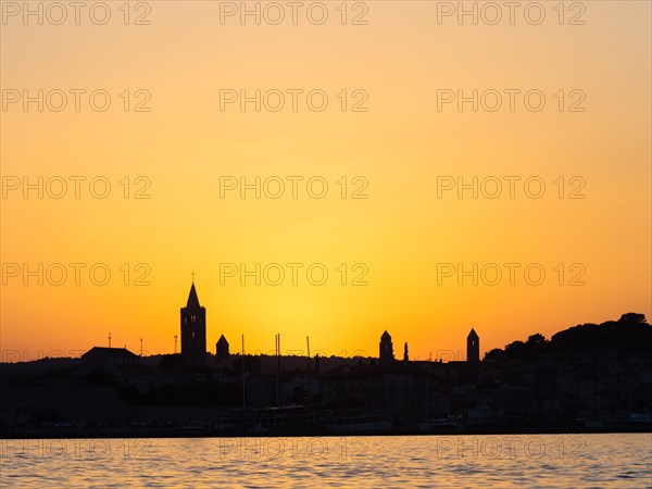 Sunset after sunset, silhouette of the church towers of Rab, town of Rab, island of Rab, Kvarner Gulf Bay, Croatia, Europe