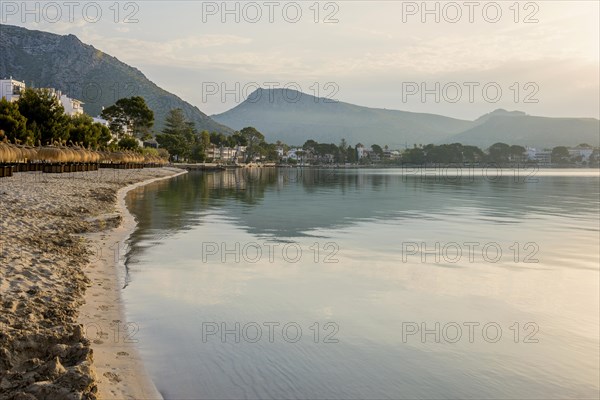 Village by the sea and mountains at sunrise, Port de Pollenca, Serra de Tramuntana, Majorca, Balearic Islands, Spain, Europe