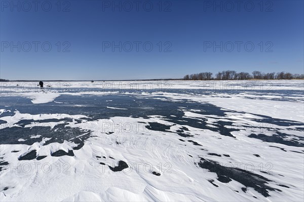 Winter, snow drifts on frozen riverscape, Saint Lawrence River, Province of Quebec, Canada, North America