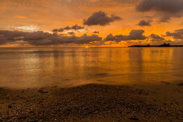 Beautiful sunset over ocean water taken from a beach in Guam