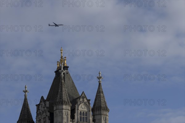 Aircraft of Japan airlines in flight over Tower Bridge, London, England, United Kingdom, Europe