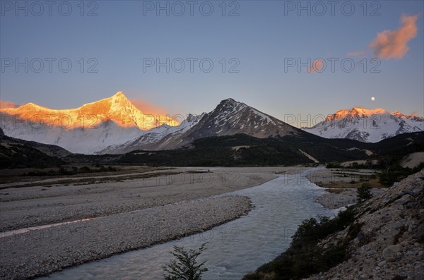 Sunrise and moon on the glaciated Cerro San Lorenzo and Cerro Hermoso, Perito Moreno National Park, Patagonia, Argentina, South America