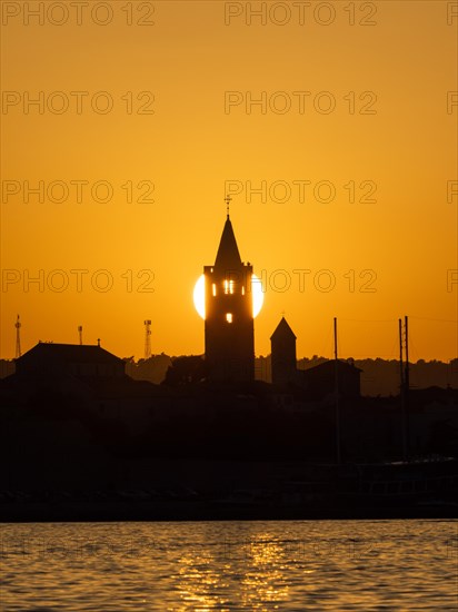 Golden evening light at sunset, silhouette of the church towers of Rab, town of Rab, island of Rab, Kvarner Gulf Bay, Croatia, Europe