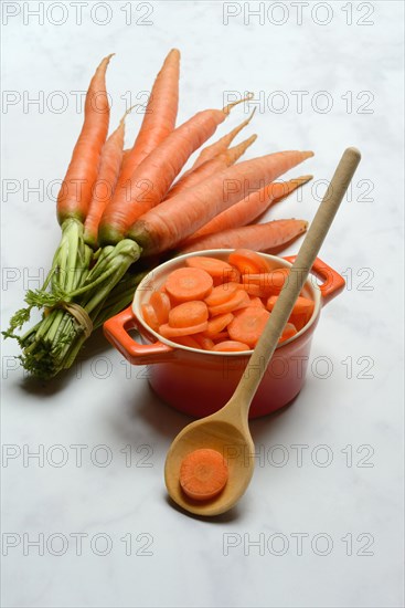 Sliced carrots in pot and bunch Carrots, Daucus carota, carrots