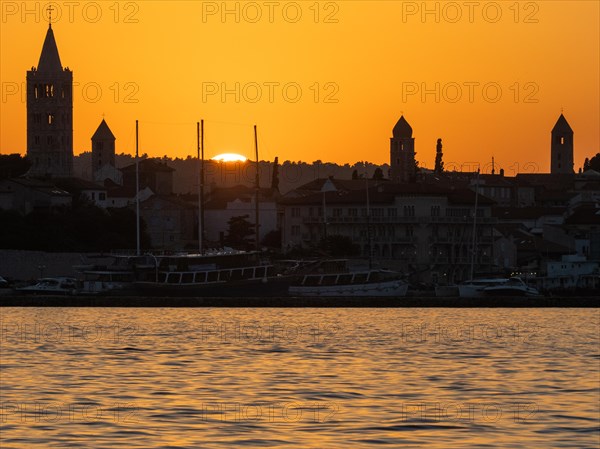 Sunset, silhouette of the church towers of Rab, town of Rab, island of Rab, Kvarner Gulf Bay, Croatia, Europe