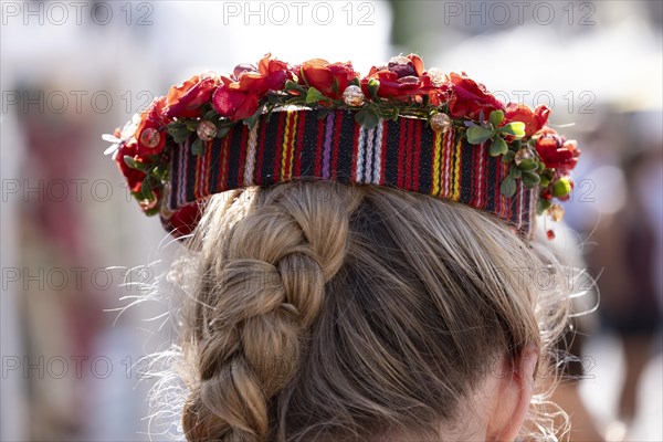Riga. Ligo Festival. Folk dance on the town square. Headdress of a young woman with a wreath of flowers, Riga, Latvia, Europe