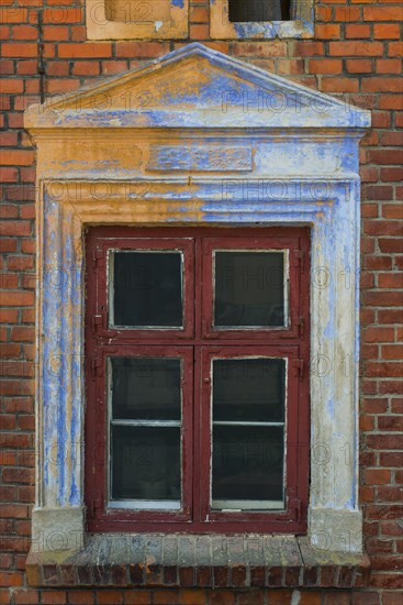 Window, facade, house, house wall, detail, dilapidated, withered, peeling, paint, brick, old, historic, empty, abandoned, construction, flaking, colourful, warm-toned, renovation, in need of renovation, repair, wooden frame, window frame, crisis, architecture