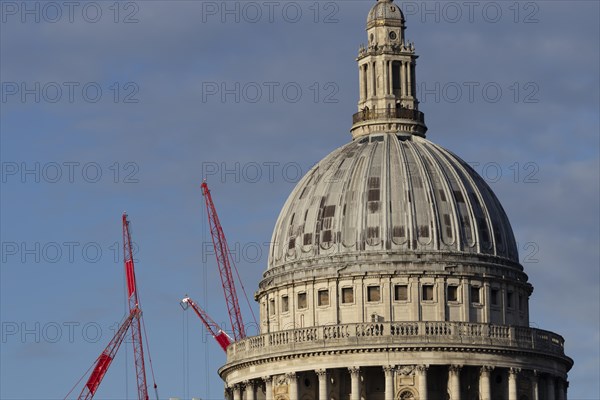 Dome of St Paul's Cathedral with industrial cranes in the background, City of London, England, United Kingdom, Europe