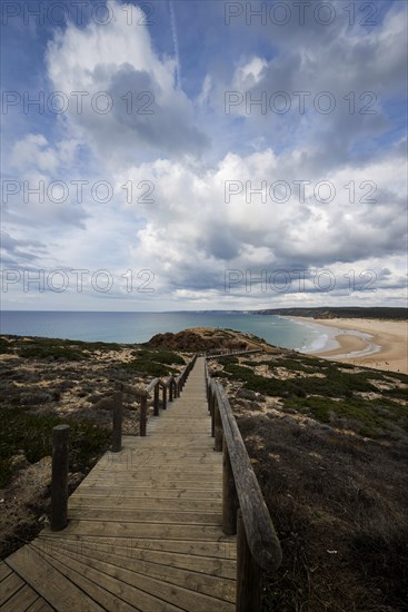 Coastal section at the southern Algarve, panorama, nature, rocky coast, beach, beach section, bay, sea bay, overview, tourism, journey, holiday, beach walk, landscape, beach landscape, natural landscape, nobody, empty, summer, cloudy, Atlantic, Atlantic Ocean, stairs, wooden walkway, national park, Carrapateiera, Portugal, Europe