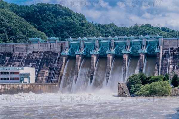 Water from reservoir rushing over spillway after torrential monsoon rains in Daejeon South Korea