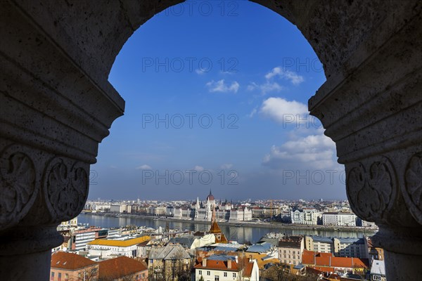 View through the facade of the Fisherman's Bastion to the Danube and the Parliament, politics, city view, travel, city trip, tourism, overview, Eastern Europe, architecture, building, history, historical, cityscape, river, capital, Budapest, Hungary, Europe