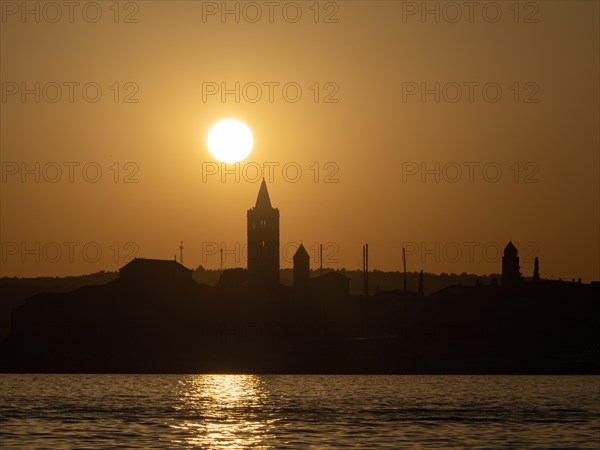 Sunset, silhouette of the church towers of Rab, town of Rab, island of Rab, Kvarner Gulf Bay, Croatia, Europe