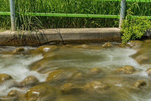 Close-up of a stream with water flowing over rocks, in South Korea