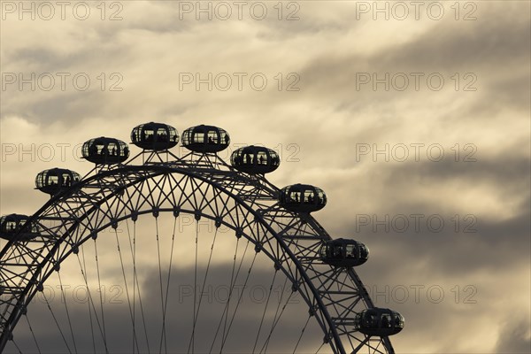 London Eye or Millennium Wheel tourist observation wheel close up of pods at sunset, City of London, England, United Kingdom, Europe
