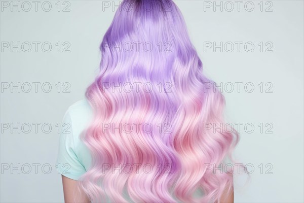 Back view of woman with long wavy pastel pink and purple hair. KI generiert, generiert AI generated