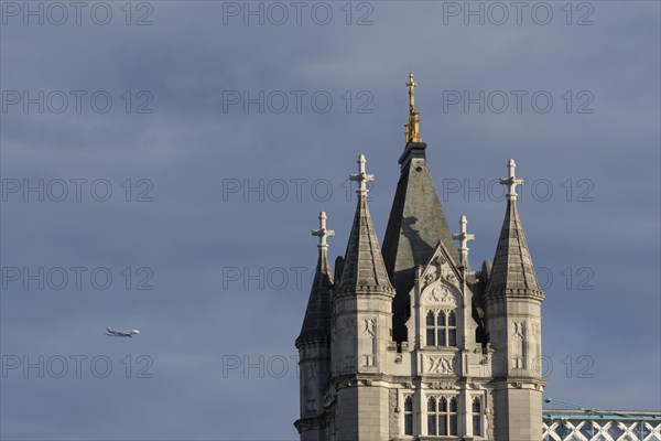 Airbus A380 aircraft of Emirates airlines in flight with Tower Bridge in the foreground, London, England, United Kingdom, Europe