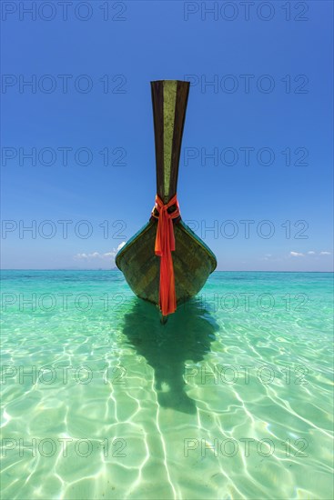 Longtail boat, fishing boat, wooden boat, decorated, tradition, traditional, faith, cloth, colourful, bay, sea, ocean, Andaman Sea, tropical, tropical, island, water, beach, beach holiday, Caribbean, environment, clear, clear, clean, peaceful, picturesque, sea level, climate, travel, tourism, paradisiacal, beach holiday, sun, sunny, holiday, dream trip, holiday paradise, paradise, coastal landscape, nature, idyllic, turquoise, Siam, exotic, travel photo, sandy beach, seascape, Phi Phi Island, Thailand, Asia