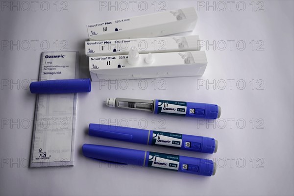 Ozempic injection pens and needle packages arranged on a table, for diabetes 2 patients, Stuttgart, Baden-Wuerttemberg, Germany, Europe