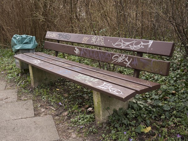 Park bench, graffiti, rubbish bin, Lueneburg, Lower Saxony, Germany, Europe