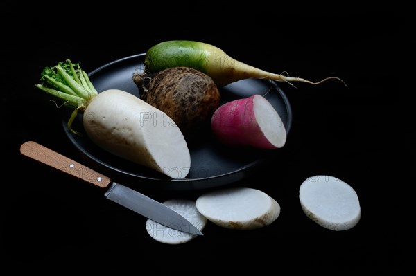 Various radishes on a plate, sliced, Raphanus